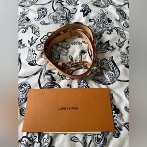 Louis Vuitton leather purse strap.